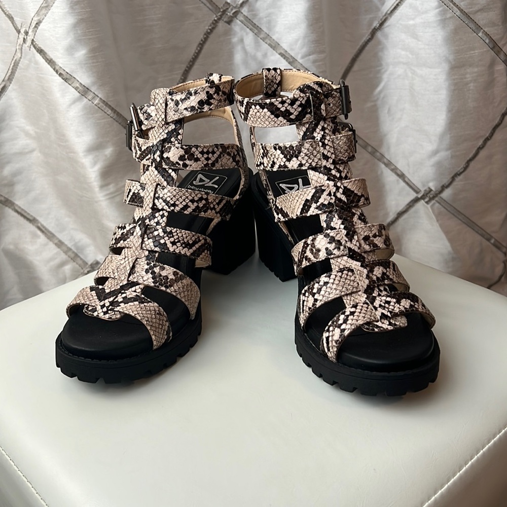 Never worn heeled sandal